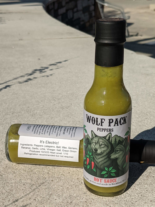 Two bottles of Wolf Pack Peppers It's Electric! hot sauce